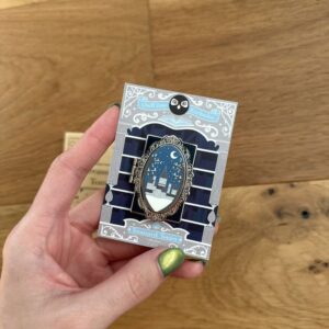 Spinning Silver Owlcrate exclusive pin